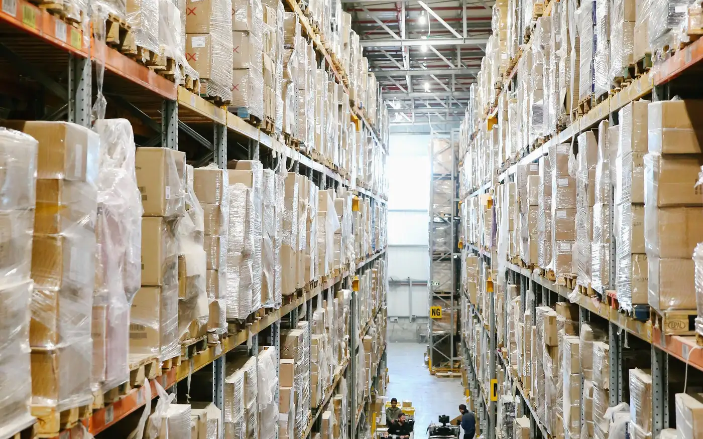 A warehouse aisle lined with boxed stock