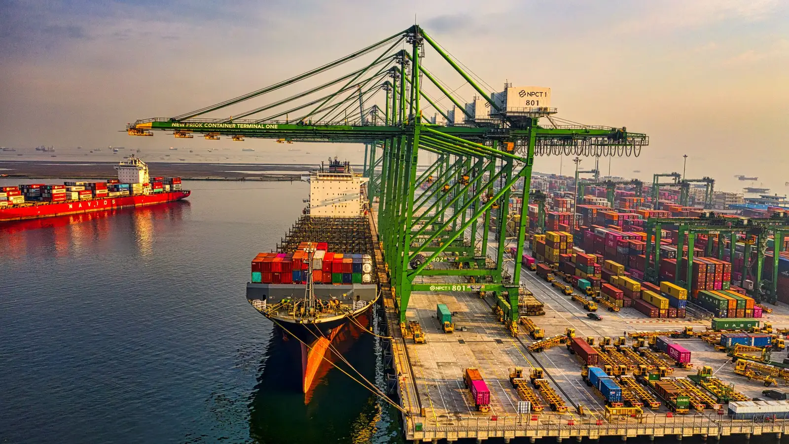 A cargo ship at a container port, seen from above
